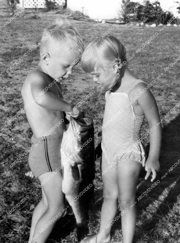 crp-15396 1948 kids Sandy Deemer & Jerry Anderson inspect bass fish caught at Nag's Head crp-15396