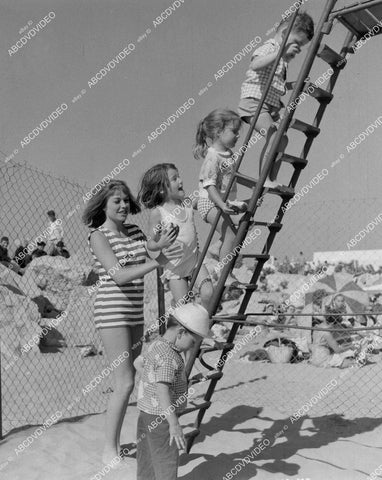 crp-01659 1963 Liliane Brousse and the kids go down the slide at beach Hammer film Maniac crp-01659