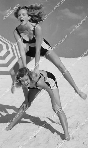 crp-00240 1948 superb pinup beach babes Diane Van Dusen Jean Strickland play leap frog in Sarasota Fla crp-00240