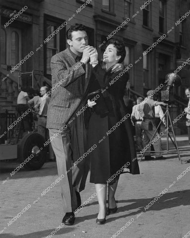crp-03590 1957 Jean Simmons lights cigarette Anthony Franciosa behind scenes This Could Be the Night crp-03590