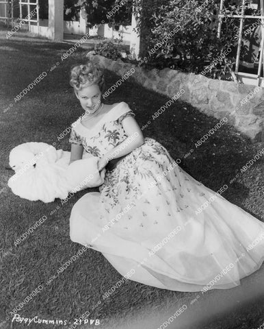 crp-03872 1950's beautiful Peggy Cummins displays new fashion laying in the grass crp-03872