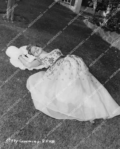 crp-03874 1950's beautiful Peggy Cummins displays new fashion laying in the grass crp-03874