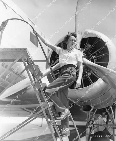 crp-04019 1938 Louise Campbell climbing in the airplane film Men with Wings crp-04019