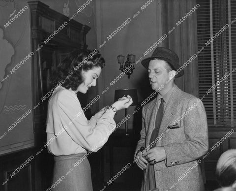 crp-05116 1940 Rosalind Russell adjusts charm bracelet w Alexander Hall on set This Thing Called Love crp-05116