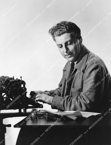 crp-05847 1930's CBS broadcaster John Nesbitt at his typewriter for MGM short subjects Passing Parade crp-05847