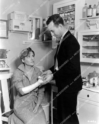 crp-06679 1933 Mae Clarke gets bandaged Columbia Studios doctor Thomas Griffin after fire scene film Parole Girl crp-06679