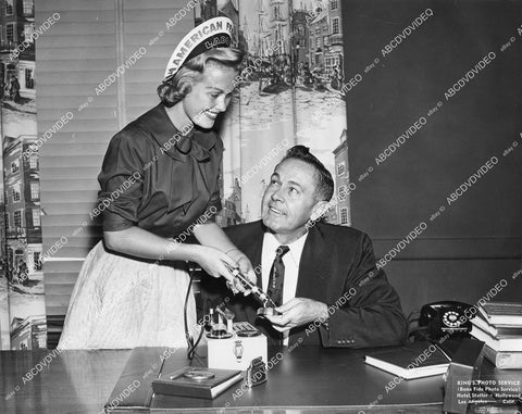 crp-00693 1955 Beverly Christensen Miss AFL demonstrates use of Geiger Counter W J Bassett Union Label Show director crp-00693