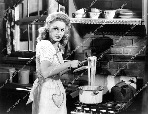 crp-07525 1942 Janet Blair in the kitchen making some spaghetti film My Sister Eileen crp-07525
