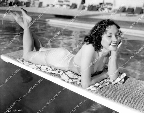 crp-08203 1930's sexy Lynn Bari in new swimwear laying on the diving board crp-08203