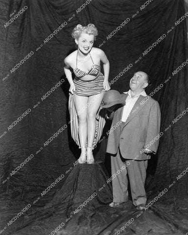 crp-08812 1940's Little Jack Little, burlesque dancer Jeannie The Dresden Doll of Burlesque hikes up skirt shows off legs Burbank Burlesque Theatre crp-08812