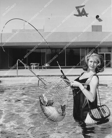 crp-00950 1950's Jackie Sauthier of Geneva salmon fishing in Las Vegas Stardust Hotel swimming pool crp-00950